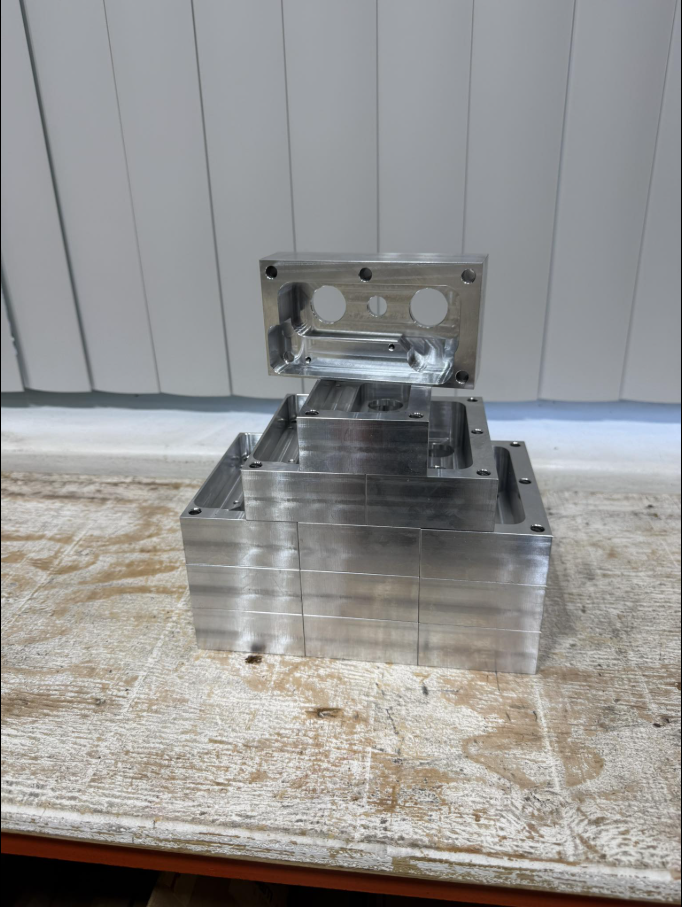 Stack of precision machined aluminum parts